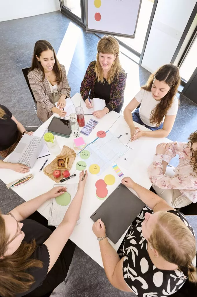 Group of female students at the table.